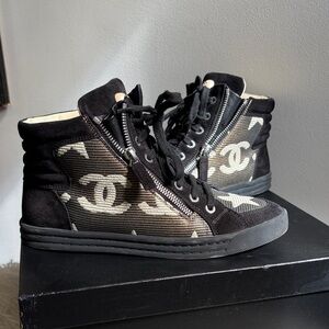 CHANEL Black High-Top Sneakers with Cream Star & CC Motif